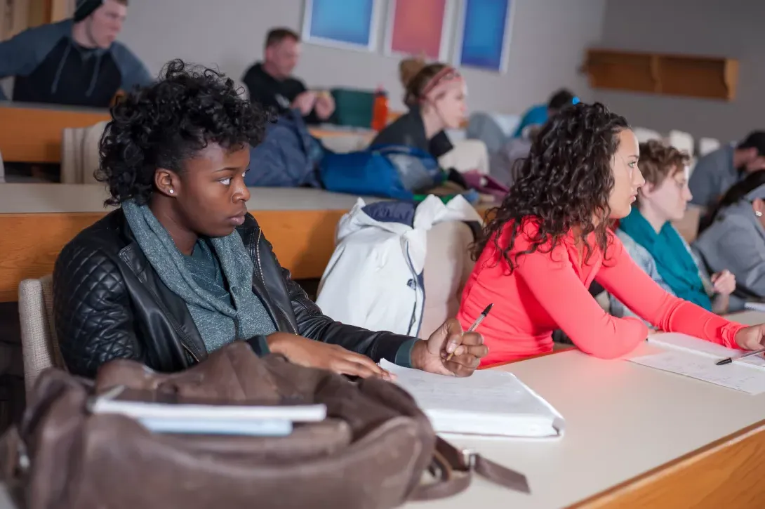 Students in Philosophy class taking notes